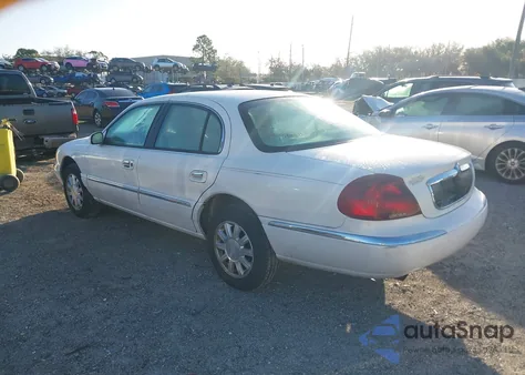 2001 Lincoln Continental z USA, uszkodzony, nr VIN 1LNHM97VX1Y663183
